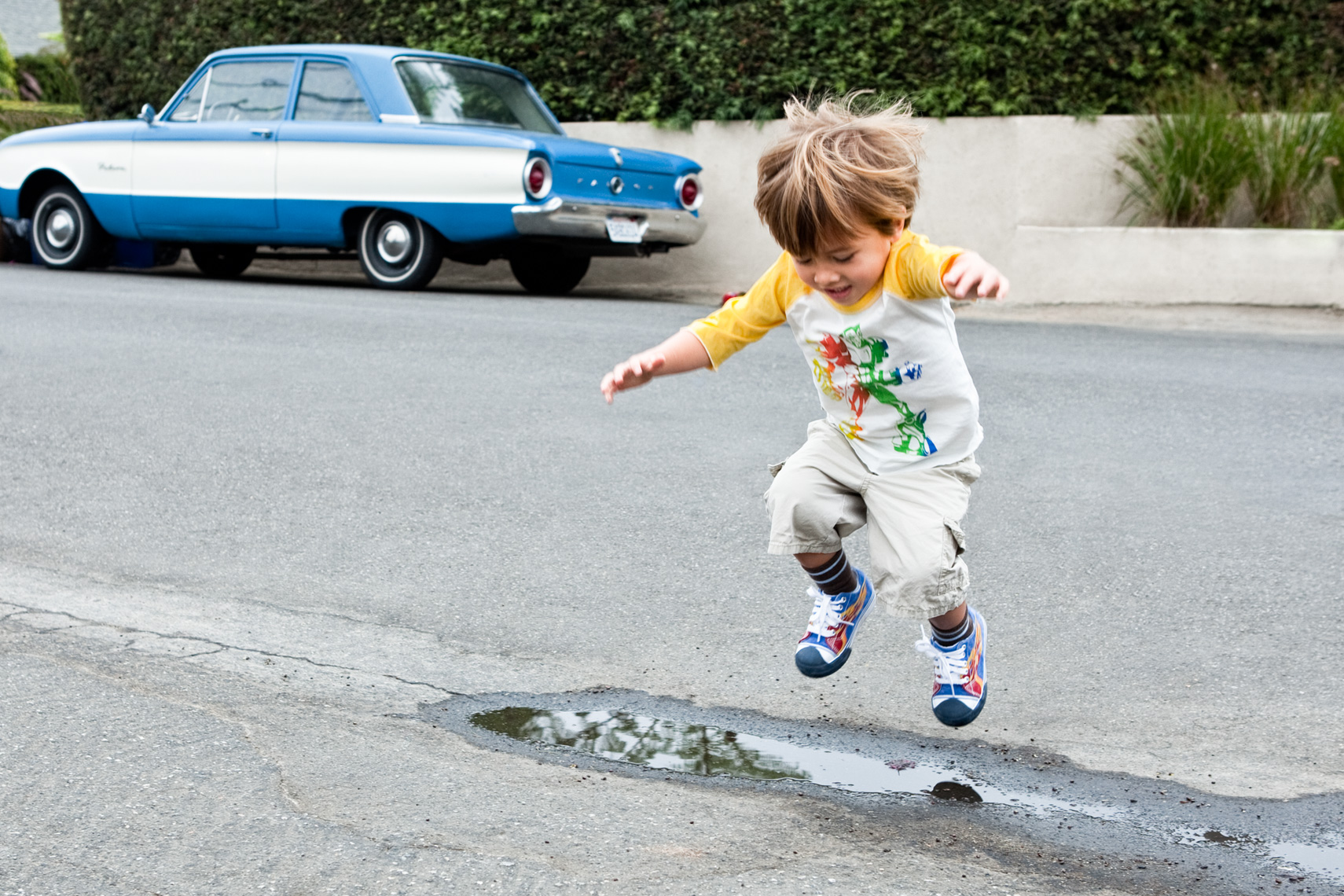 Los Angeles portrait Photography, Michael Brian, dog, pet, cat, children, lifestyle, Young boy jumps over puddle