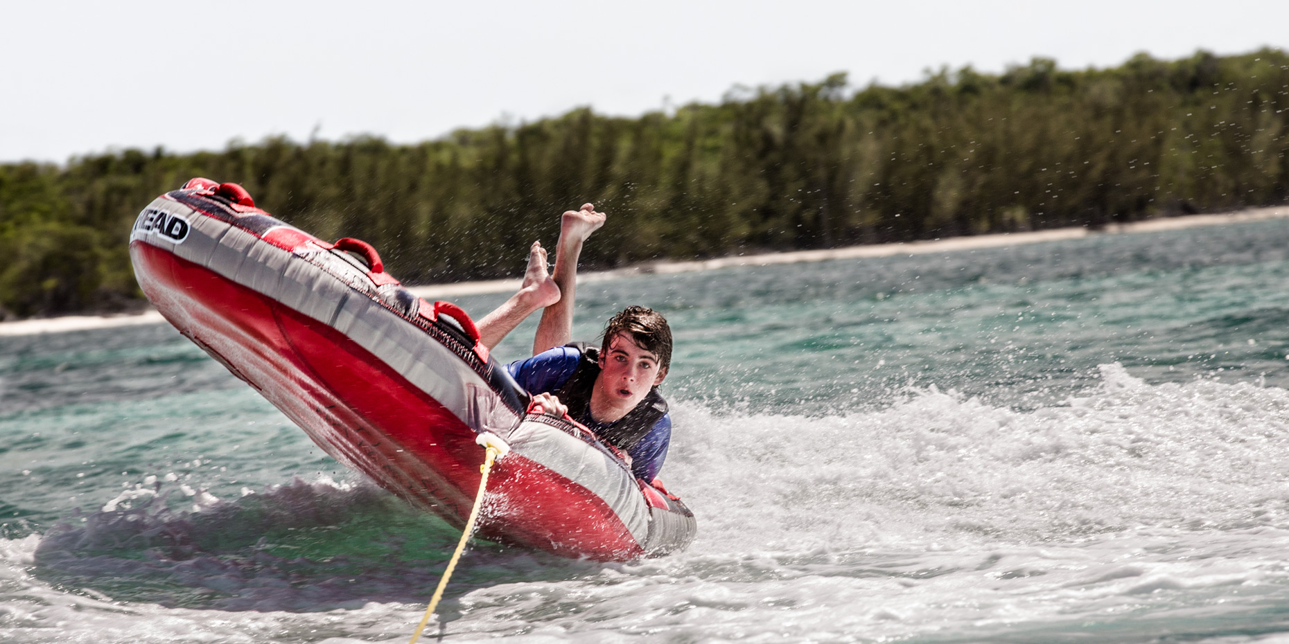 Los Angeles portrait Photography, Michael Brian, dog, pet, cat, teen, lifestyle, Young boy about to flip over while tubing in Harbour Island, Bahamas